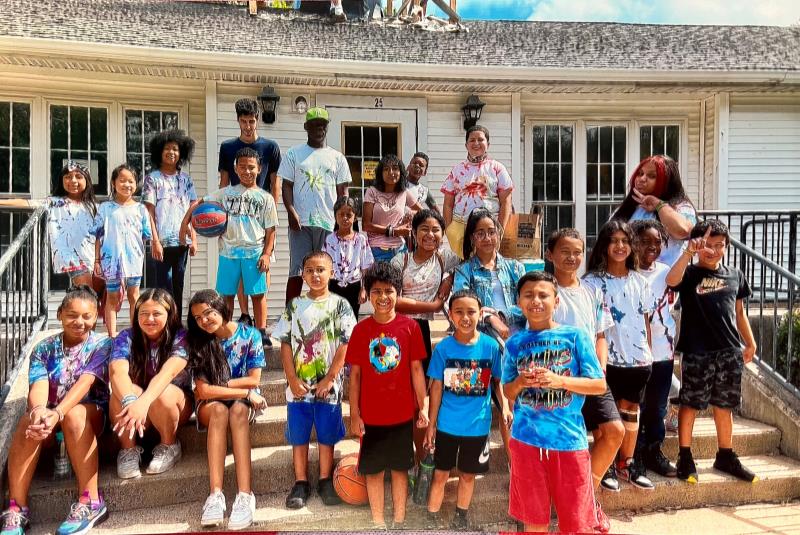 Children standing in front of Youth and family services building