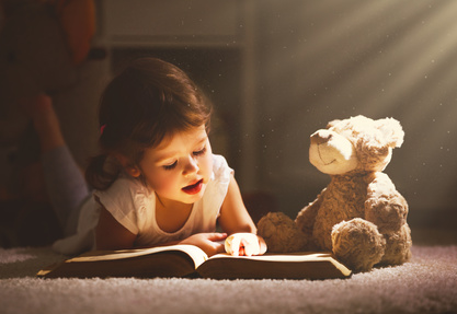 Girl Reading to Teddy Bear-copyright JenkoAtaman/Fotolia.com